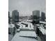 Snowy winter cityscape, viewed through a window with raindrops at 3324 Peachtree Ne Rd # 2118, Atlanta, GA 30326