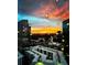 Dramatic sunset view of the city skyline, visible through a window with water droplets at 3324 Peachtree Ne Rd # 2118, Atlanta, GA 30326