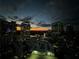 Nighttime view of the city with illuminated skyscrapers set against a cloudy, twilight sky at 3324 Peachtree Ne Rd # 2118, Atlanta, GA 30326