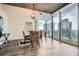 Dining area featuring a modern table, wicker chairs, and floor-to-ceiling windows showcasing the city skyline at 3324 Peachtree Ne Rd # 2118, Atlanta, GA 30326