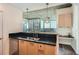 Bright kitchen with stainless steel sink with city views and eat in countertop bar at 3324 Peachtree Ne Rd # 2118, Atlanta, GA 30326