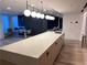 Contemporary kitchen island with bar seating and modern pendant lighting at 3324 Peachtree Ne Rd # 2118, Atlanta, GA 30326
