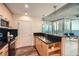 Bright kitchen boasting modern black countertops and views of the surrounding city skyline at 3324 Peachtree Ne Rd # 2118, Atlanta, GA 30326