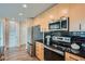 Beautiful kitchen with stainless steel appliances, microwave, and black backsplash at 3324 Peachtree Ne Rd # 2118, Atlanta, GA 30326