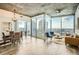 Spacious living area with floor-to-ceiling windows, stylish furniture, and stunning city views at 3324 Peachtree Ne Rd # 2118, Atlanta, GA 30326