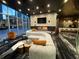 Stylish lounge with contemporary furniture, elegant lighting, a fireplace, and expansive windows overlooking city views at 3324 Peachtree Ne Rd # 2118, Atlanta, GA 30326