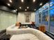 Modern lounge area featuring comfortable seating, large windows, and sleek, dark ceilings with recessed lighting at 3324 Peachtree Ne Rd # 2118, Atlanta, GA 30326