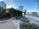 Rooftop terrace with a fire pit, comfortable seating, lush greenery, and panoramic city views at 3324 Peachtree Ne Rd # 2118, Atlanta, GA 30326
