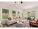 Bright living room with abundant natural light, stylish decor, and seamless flow into the dining area at 9446 Cedar Grove Ct # 334, Jonesboro, GA 30238