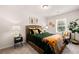 Stylish bedroom featuring a woven headboard, neutral walls, and tasteful decor at 9448 Cedar Grove Ct # 333, Jonesboro, GA 30238