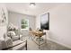 A home office with a modern desk, comfortable seating, and natural light at 9448 Cedar Grove Ct # 333, Jonesboro, GA 30238