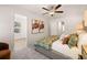 Bright bedroom with modern ceiling fan, stylish decorative art, and plush carpeting at 9450 Cedar Grove Ct # 332, Jonesboro, GA 30238