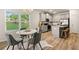 Kitchen area featuring stainless steel appliances, breakfast nook, with seating and a large window offering natural light at 9450 Cedar Grove Ct # 332, Jonesboro, GA 30238