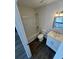 A full bathroom features a shower-tub combo, tile floors, and a vanity with sink at 3689 Deer Springs Trl, Ellenwood, GA 30294