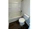 A bathroom with tile floors includes a shower-tub combination and a white toilet at 3689 Deer Springs Trl, Ellenwood, GA 30294