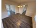 Elegant dining room showcasing modern chandelier and hardwood floors at 3689 Deer Springs Trl, Ellenwood, GA 30294