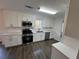 Gourmet kitchen featuring stainless steel appliances, subway tile backsplash and white cabinets at 3689 Deer Springs Trl, Ellenwood, GA 30294