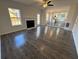 Inviting living room with fireplace and seamless access to the kitchen at 3689 Deer Springs Trl, Ellenwood, GA 30294