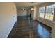Open-concept living space with fireplace, and hardwood flooring throughout at 3689 Deer Springs Trl, Ellenwood, GA 30294