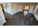 Spacious living area showcasing updated floors and staircase at 3689 Deer Springs Trl, Ellenwood, GA 30294