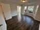 Bright and airy living space featuring hardwood floors and bay windows at 3689 Deer Springs Trl, Ellenwood, GA 30294