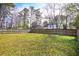 Large, well-maintained backyard featuring a wood fence, perfect for outdoor activities and privacy at 6929 Hickory Log Rd, Austell, GA 30168