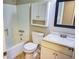 Bathroom featuring a shower-tub combo, toilet, vanity with sink, medicine cabinet, and a mirror at 6929 Hickory Log Rd, Austell, GA 30168