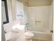 Bathroom featuring a single vanity and a shower-tub combination with white tile at 6929 Hickory Log Rd, Austell, GA 30168