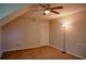 Comfortable bedroom featuring a ceiling fan, neutral walls, and a closet with ample storage space at 6929 Hickory Log Rd, Austell, GA 30168