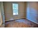 Bedroom featuring neutral walls, carpeted floors, a window view, and white trim at 6929 Hickory Log Rd, Austell, GA 30168
