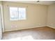 Bedroom with neutral walls, plush carpeting, and a bright window overlooking the outdoors at 6929 Hickory Log Rd, Austell, GA 30168