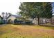 Charming home featuring well maintained lawn and landscaping, offering curb appeal and a welcoming ambiance at 6929 Hickory Log Rd, Austell, GA 30168