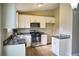Updated kitchen featuring stainless steel appliances, granite countertops, and ample cabinet space at 6929 Hickory Log Rd, Austell, GA 30168
