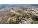 Sprawling aerial view of a residential area with mature trees providing privacy and shade at 3032 Ross Rd, Snellville, GA 30039