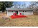 Spacious backyard with a well-maintained lawn and a charming red deck at 3351 Creatwood Se Trl, Smyrna, GA 30080