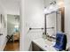 Clean bathroom vanity with a decorative mirror and wall mounted towel bar at 3351 Creatwood Se Trl, Smyrna, GA 30080