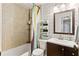 Bathroom with shower/tub, decorative wallpaper, and modern vanity at 3351 Creatwood Se Trl, Smyrna, GA 30080