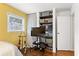 Bedroom featuring a large TV, shelving and hardwood floors at 3351 Creatwood Se Trl, Smyrna, GA 30080