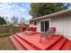A red deck with outdoor seating and a table perfect for outdoor gatherings at 3351 Creatwood Se Trl, Smyrna, GA 30080