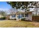 Inviting single-story home with a covered carport, blue shutters, manicured landscaping, and a welcoming entrance at 3351 Creatwood Se Trl, Smyrna, GA 30080