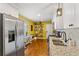 Modern kitchen with stainless steel appliances, white cabinets, granite countertops, and hardwood floors at 3351 Creatwood Se Trl, Smyrna, GA 30080