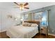 Calming bedroom with a ceiling fan, natural light, and decorative lamps and side tables at 3351 Creatwood Se Trl, Smyrna, GA 30080