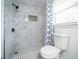 Updated bathroom with a modern tile shower, offering a fresh and stylish feel at 4324 Rue Saint Michel, Stone Mountain, GA 30083