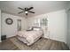 Comfortable bedroom with wood-look flooring, natural light, and ensuite bathroom at 4324 Rue Saint Michel, Stone Mountain, GA 30083