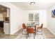 Cozy dining area with a glass-top table and modern chairs at 4324 Rue Saint Michel, Stone Mountain, GA 30083