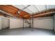 Spacious garage with exposed wood ceiling and utility hookups at 4324 Rue Saint Michel, Stone Mountain, GA 30083