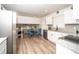 Modern kitchen featuring white cabinets, granite countertops, and stainless steel appliances at 4324 Rue Saint Michel, Stone Mountain, GA 30083