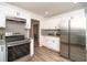 Contemporary kitchen featuring sleek appliances and ample counter space at 4324 Rue Saint Michel, Stone Mountain, GA 30083