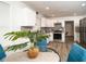 Bright kitchen with white cabinets, modern appliances, and stylish backsplash at 4324 Rue Saint Michel, Stone Mountain, GA 30083
