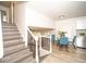 Open-concept living space with a staircase and dining area, connecting kitchen and living room at 4324 Rue Saint Michel, Stone Mountain, GA 30083